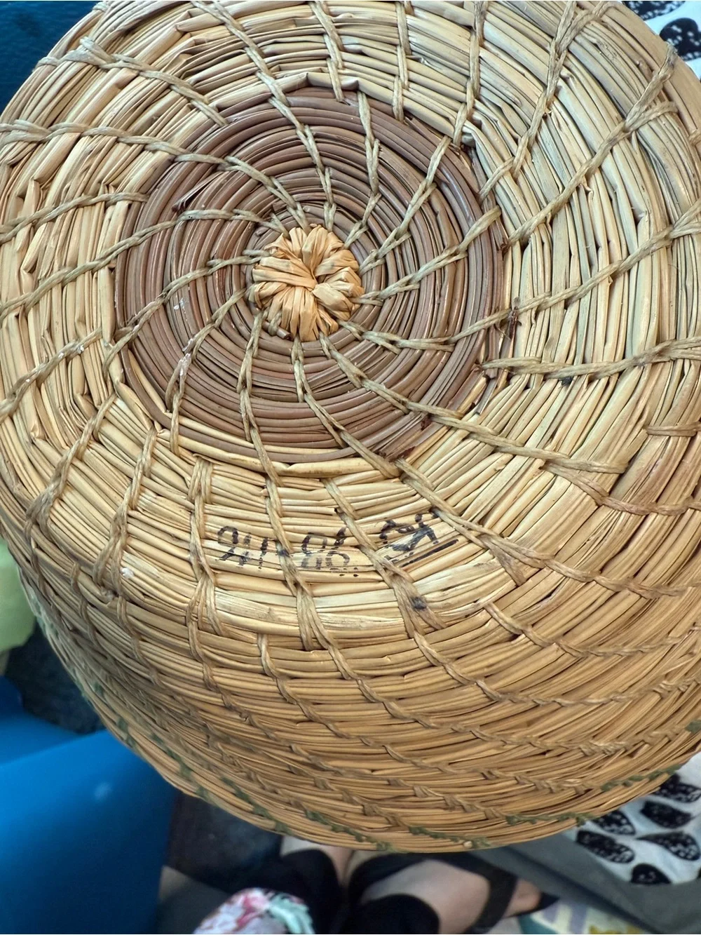 vintage Native American style pine needle basket, similar to those identified